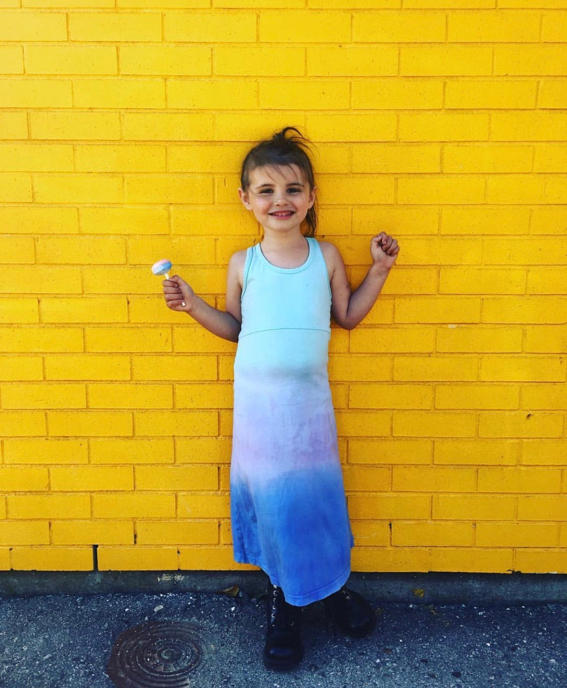 Child in a pre-loved denim jacket