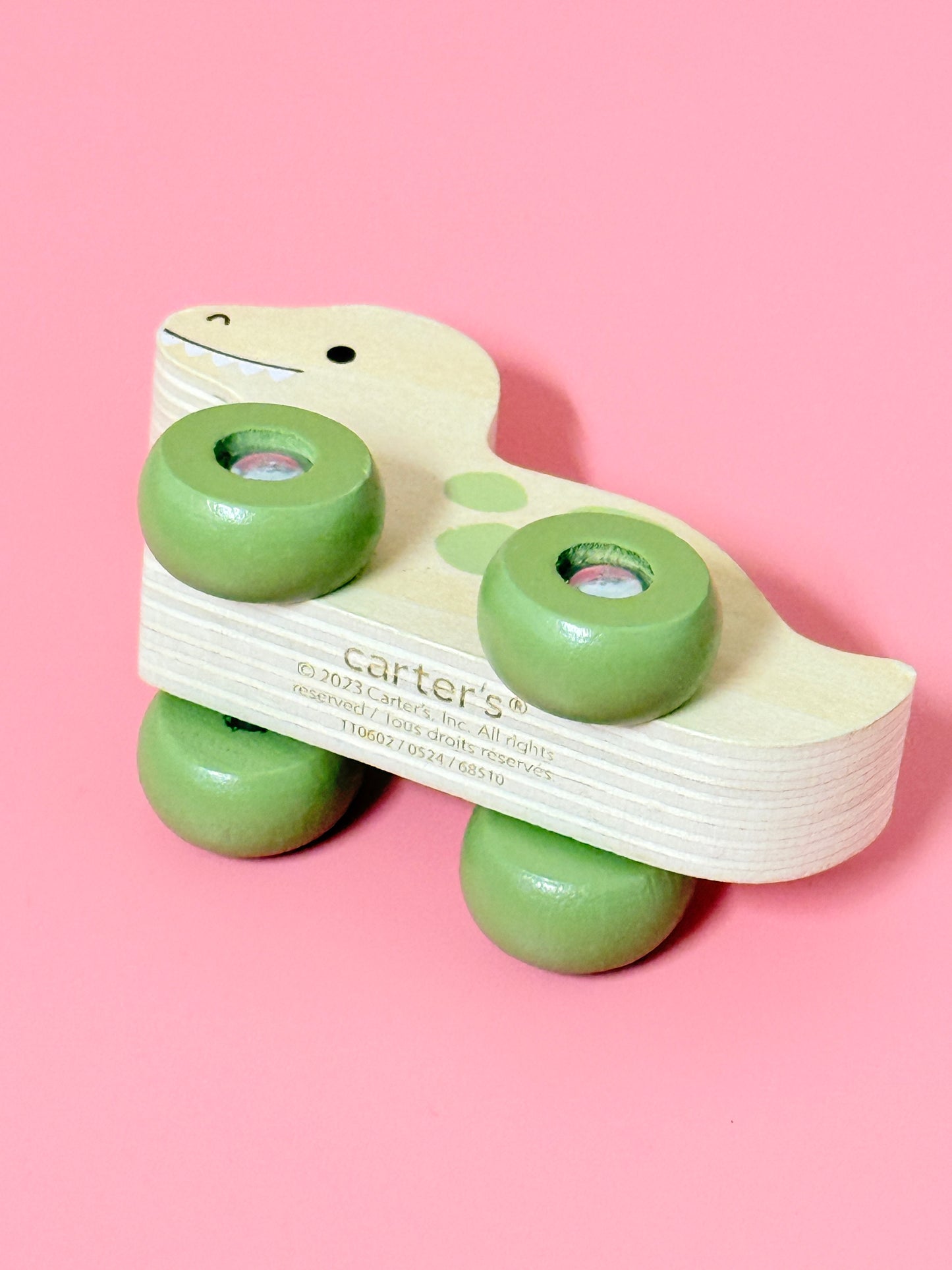 Carters Dinosaur on wheels