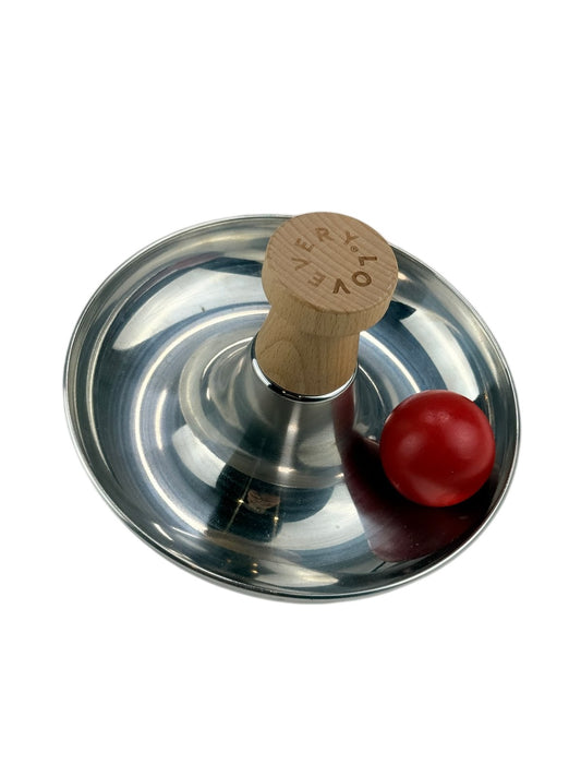 Lovevery Metal Spinning Bowl Toy with Red Ball