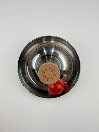 Lovevery Metal Spinning Bowl Toy with Red Ball